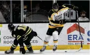  ?? ASSOCIATED PRESS ?? Colorado College forward Hunter McKown battles Western Michigan forward Chad Hillebrand for the puck during a game last month in Colorado Springs. McKown, a center, is joining the Blue Jackets.