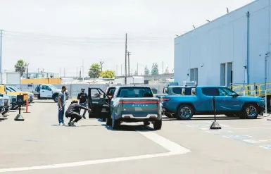  ?? ALEX WELSH/THE NEW YORK TIMES ?? Carmaker Rivian has only 19 U.S. showrooms and service centers, including this one in El Segundo, Calif.