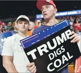  ?? Mandel Ngan AFP via Getty Images ?? PRESIDENT Trump vowed to revive coal, but the industry hasn’t come back and there’s reason to doubt it will. Above, supporters at a rally in Charleston, W.Va.