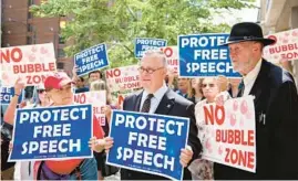  ?? ?? Joseph Scheidler, right, stands with anti-abortion supporters outside Planned Parenthood in the 1200 block of North La Salle Streetin Chicago in 2016.