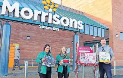  ?? ?? Happy to help Gavin Penman, Kilmberly Cairns , Shell Foley at the Morrisons Store Hamilton, are delighted to be involved with the toy appeal