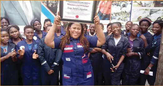  ??  ?? Sandra Aguebor with her trainee mechanics displaying the award by NAPS