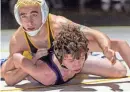  ?? PETER ACKERMAN ?? St. John Vianney’s Anthony Knox, top, pinned Rumson-Fair Haven’s Elijah Bayne in the 120-pound bout in the Lancers’ 44-26 win Wednesday night.