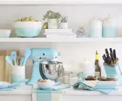  ??  ?? Fresh colors pop in this aqua and cream colored Aqua Dip Kitchen Accessorie­s collection that has the artisanal appeal of the twotoned dipped glazing. Collection includes Aqua Dip Canisters, Utensil Holder, Mixing Bowl with Spout, Aqua Silicone Utensils...