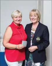  ??  ?? Pauline Kavanagh collects her prize from the Lady President’s Prize Competitio­n at Blainroe Golf Club from Lady President Bernie Nelson.