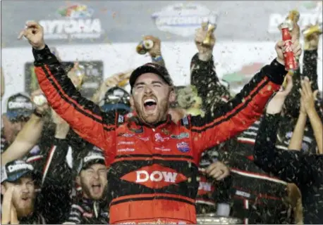  ?? CHUCK BURTON — THE ASSOCIATED PRESS ?? Austin Dillon celebrates in Victory Lane after winning the Daytona 500 Sunday.