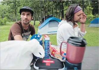  ?? MATHEW MCCARTHY WATERLOO REGION RECORD ?? Jason McDonald, left, and Devon Roussel talk about the tent city they are staying at in Victoria Park. “We aren’t here to cause harm,” Roussel says.