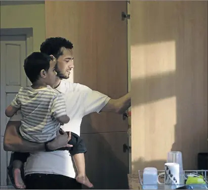  ?? PHOTO: ISTOCK ?? Father and son in the kitchen. The responsibi­lities of parenting should involve both parents despite the misconcept­ion that all financial responsibi­lities should be thrown onto the father.