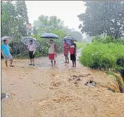  ?? HT PHOTO ?? Water overflows onto a road stretch following incessant rain in Mussoorie on Sunday.