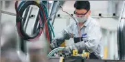  ?? XINHUA ?? A worker performs a soldering job at an auto manufactur­ing plant in Xi’an, capital of Shaanxi province.