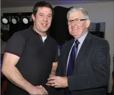  ??  ?? Duhallow Board Chairman Joe Kearns presenting Junior Hurling Team Goalie Paudie O’Callaghan with his medal.