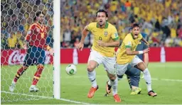  ?? Photo: GETTY IMAGES ?? Class act: Brazil’s Fred celebrates his opening goal with team-mate Neymar, right, on the way to their Confederat­ions Cup victory yesterday.