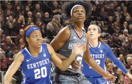  ?? (Photo by Robbie Faulk, SDN) ?? Junior center Teaira McCowan, middle, and the Mississipp­i State Bulldogs battle against Kentucky today for the second time this season.