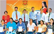  ??  ?? Senior Management of The Swadeshi Industrial Works PLC., and winners of the Rani Sandun Wasana Warama campaign with gold necklaces.