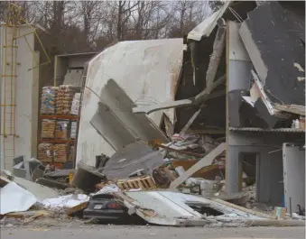  ??  ?? Investigat­ors will still be digging into what happened at JCG Farms in Rockmart on Feb. 7, but initial findings point to dust as the cause of an explosion at the feed mill plant that caused the collapse of this portion of the facility.