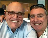  ?? (AP/House Judiciary Committee) ?? Rudy Giuliani and indicted businessma­n Lev Parnas pose in an undated image. President Donald Trump has repeatedly denied knowing Parnas, despite numerous photos of them together and now a video that appears to include a conversati­on between them.