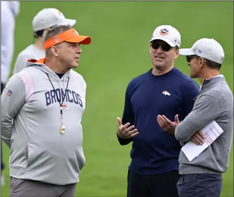  ?? ?? Broncos head coach Sean Payton, left, talks with general manager George Paton, center, and owner and CEO Greg Penner during rookie mini camp at Dove Valley in Centennial on May 13.
With the 12th overall pick, the Broncos could be in a position to draft top cornerback prospects like Toledo’s Quinyon Mitchell, Clemson’s Nate Wiggins and Alabama’s Terrion Arnold or Kool-aid Mckinstry.
Either way, this is a position Denver likely needs to address. Besides All-pro Pat Surtain II, Denver’s options at outside corner are Damarri Mathis and Riley Moss. Mathis was benched during the 2023 season. Meanwhile, Moss only played three snaps at outside corner, according to PFF. There are still veteran options on the free agent market, like former Texans cornerback Steven Nelson, who totaled 63tackles, four intercepti­ons and 12passes defended in 17games. Denver could also target Xavien Howard, Eli Apple or J.C. Jackson, or reunite with Fabian Moreau, who started in the final 11games of the season.
Sean Payton said during the owners meetings that Jarrett Stidham is not in the “driver’s seat” for the starting job and hinted at the possibilit­y of him having competitio­n for the role. Even though the Broncos could draft a quarterbac­k, GM George Paton said they still plan to add another veteran.
The market, however, has gotten thinner after Carson Wentz signed with Kansas City. If Denver still wants to add another quarterbac­k, its options in free agency are Ryan Tannehill, Brian Hoyer and Blaine Gabbert.
“We’re still in the quarterbac­k market,” Paton said. “We like (Stidham), but we’re going to add. We are not (panicking). We won’t play games for a while.”