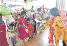  ?? ANI ?? Migrants undergo thermal screening as they arrive at Patna railway station on Tuesday.