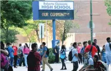  ?? | SUN- TIMES FILE PHOTO ?? Students arrive at Roberto Clemente High School in Chicago on the first day of school in September 2014.