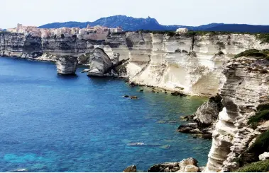  ??  ?? Above left: Barb walks down to a beach. Above right: One of the many lizards on the trail. Middle left: Bonifacio the most stunning town in Corsica.