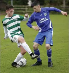  ??  ?? Greystones’ Michael Gray competes with Roundwood’s Nathan Quinn.