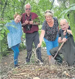  ?? Picture: Wallace Ferrier. ?? Examining the nest where eight cold eggs were found are, from left, Morag Lindsay, Mickey Mellon, Jean Stewart and George Park.