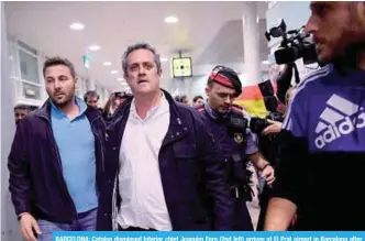  ??  ?? BARCELONA: Catalan dismissed Interior chief Joaquim Forn (2nd left) arrives at El Prat airport in Barcelona after flying from Brussel. —AFP