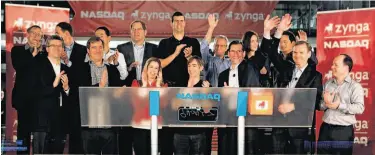  ?? Zef Nikolla / Nasdaq 2011 ?? Zynga CEO Mark Pincus (center) rings the opening bell on the Nasdaq Stock Market after taking the gaming firm public in December. The company is now the target of lawsuits alleging insider trading.