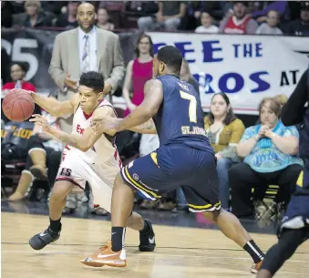  ?? DAX MELMER ?? Windsor’s Chad Frazier tries to drive past St. John’s Ryan Reid during their National Basketball League of Canada game Monday at the WFCU Centre. The Express lost 112-108.