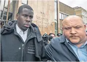  ?? ?? Kurt Zouma is escorted from court by a security guard thought to be employed by West Ham; right, the Bengal cat that was abused