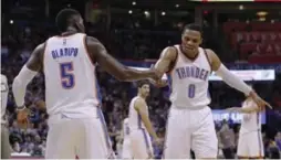  ?? ALONZO ADAMS/THE ASSOCIATED PRESS ?? Thunder guard Russell Westbrook, right, has helped players like Victor Oladipo grow into bigger roles in Oklahoma City.