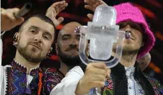  ?? ?? Members of the Kalush Orchestra from Ukraine celebrate after winning the Grand Final of the Eurovision Song Contest at Palaolimpi­co arena, in Turin, Italy, Saturday, May 14