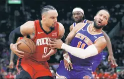  ?? Getty Images ?? CRUSHED: Dillon Brooks bowls over Jalen Brunson in the Knicks’ 105-103 loss to the Rockets that was decided by more than one bad call, writes The Post’s Mike Vaccaro.