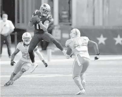  ?? CHARLES KRUPA/AP ?? Dolphins linebacker Elandon Roberts (44) prepares to hit Patriots wide receiver Julian Edelman during last Sunday’s season opener. Roberts is in the second stage of the NFL concussion protocol but has been ruled out for Sunday’s game against the Bills.