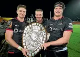  ??  ?? Kevin Barrett, centre, with sons Jordie and Scott after Canterbury won the Ranfurly Shield.