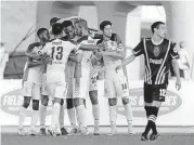  ?? [STEVEN CHRISTY/ENERGY FC] ?? The Greens celebrate one of their season-high six goals Wednesday in a 6-4 Energy FC win over Las Vegas Lights FC at Taft Stadium.