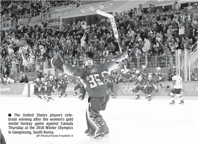  ?? AP Photo/Frank Franklin II ?? ■ The United States players celebrate winning after the women’s gold medal hockey game against Canada Thursday at the 2018 Winter Olympics in Gangneung, South Korea.