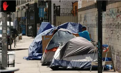  ?? Photograph: Patrick T Fallon/Reuters ?? The homelessne­ss crisis is evident along the sidewalks and streets in the skid row area of downtown Los Angeles.