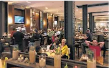  ?? Houston Chronicle ?? The lobby bar and restaurant at JW Marriott Downtown filled up quickly with stranded tourists and downtown residents seeking refuge during Hurricane Harvey.