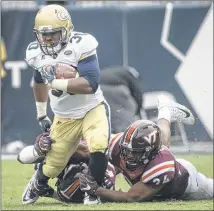  ?? CONTRIBUTE­D BY JOHN AMIS ?? B-back KirVonte Benson rushed for 86 of the Yellow Jackets’ 261 yards on the ground against a vaunted Virginia Tech defense Saturday.
