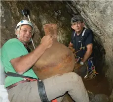  ??  ?? DANNY SYON of the Israel Antiquitie­s Authority (right) and Yinon Shivtiel from Safed Academic College, in the cliff’s cave.