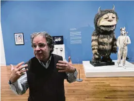  ?? AP ?? Jonathan Weinberg, artist and curator of the Maurice Sendak Foundation, discusses the legacy of illustrato­r and children’s book author Maurice Sendak during a tour of a new exhibit of Sendak, “Wild Things Are Happening” at the Columbus Museum of Art.