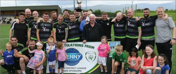  ?? Photo by Domnick Walsh ?? The Tralee Celtic players and supporters celebrate their victory in the Premier B Final replay at Mounthawk Park on Sunday.