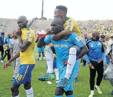  ?? /LEFTY SHIVAMBU/GALLO IMAGES ?? Sundowns players Anthony Laffor, Denis Onyango and Themba Zwane walk away from their PSL title celebratio­n scene and are now looking ahead to the CAF sojourn.