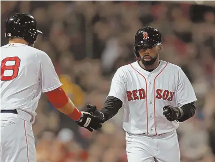  ?? STAFF PHOTOS BY STUART CAHILL ?? WELCOME SIGHT: Jackie Bradley Jr. is congratula­ted at home plate by Red Sox teammate Mitch Moreland after scoring in the second inning of last night’s series finale against the Yankees at Fenway. The Sox used a strong start from Rick Porcello (below)...