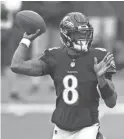  ?? AP ?? Ravens quarterbac­k Lamar Jackson throws a pass against the Titans on Sunday in Baltimore.