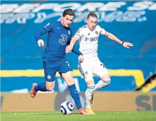  ??  ?? Chelsea’s Ben Chilwell is shadowed by Leeds United’s Jack Harrison