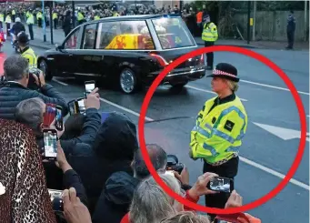  ?? ?? Solemn duty: Penny in uniform as the Queen’s coffin passes by