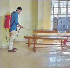  ??  ?? A health worker sanitises a counting centre in Kerala’s Thiruvanan­thapuram on Saturday, a day before votes are to be counted and assembly election results announced.