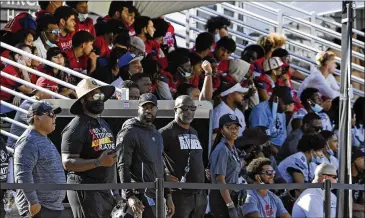  ?? DAVID BECKER/AP 2021 ?? Fans watch a Raiders practice in July in Henderson, Nevada. The team said last week all fans need proof of COVID-19 vaccinatio­n to go to games.